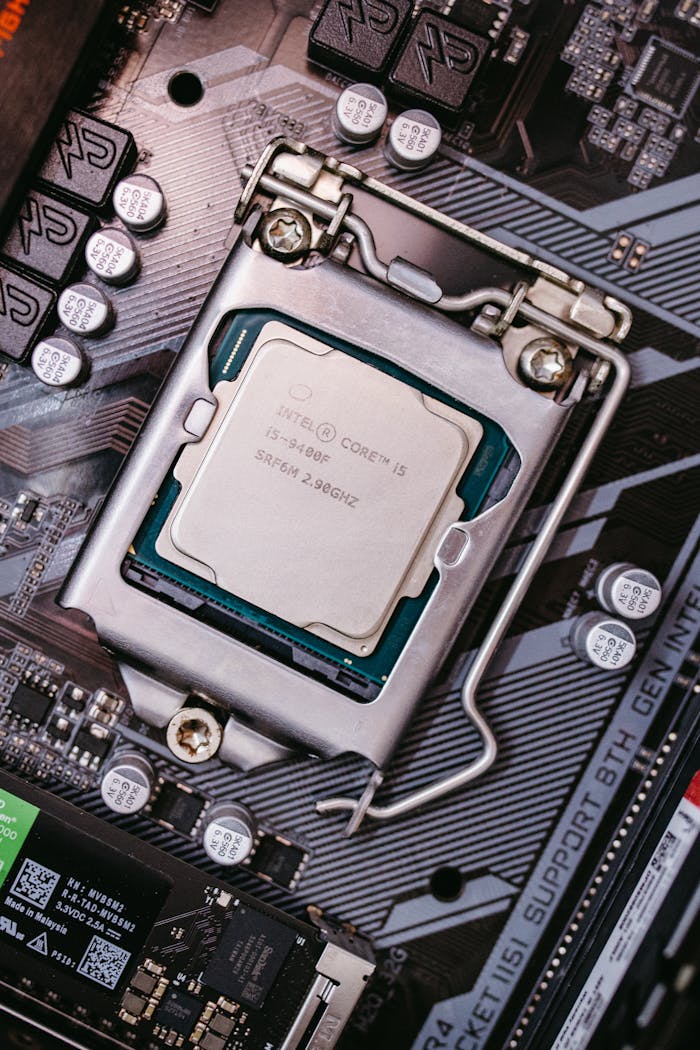 contact-img Detailed view of an Intel CPU installed on a motherboard highlighting technological components.